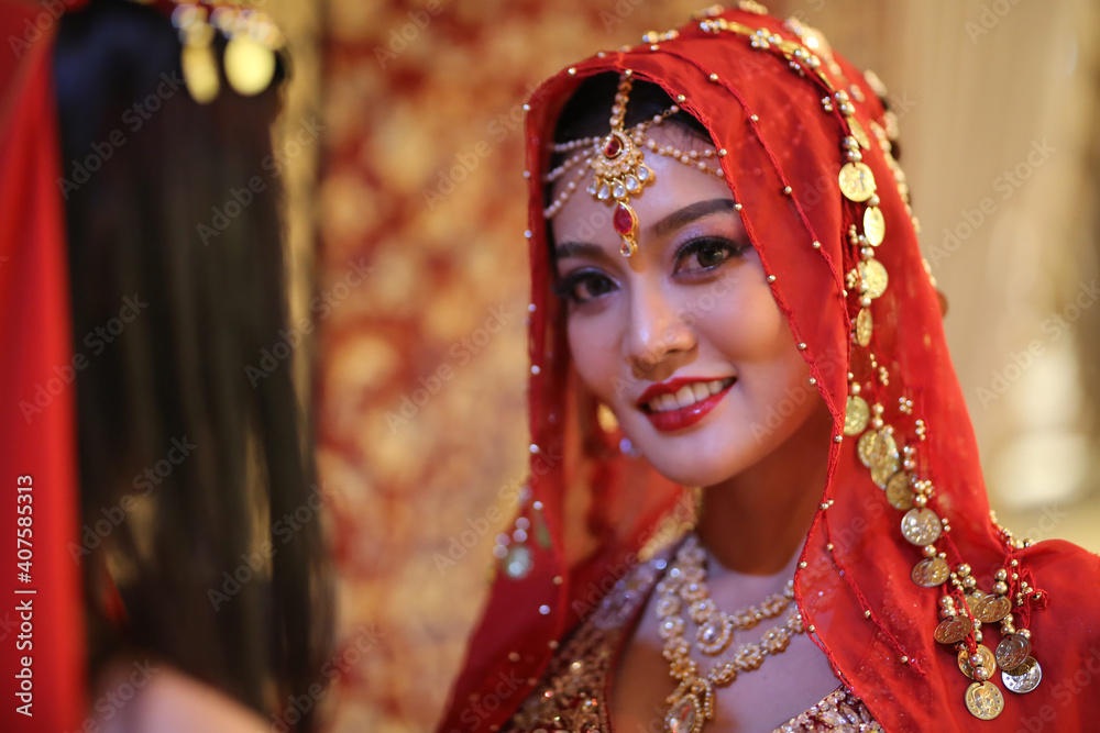 Portrait of beautiful indian girl . Young hindu woman model in sari and kundan jewelry . Traditional India costume lehenga choli . Eastern or Arabic culture. Portrait of beautiful indian girl . Young hindu woman model in sari and kundan jewelry . Traditional India costume lehenga choli . Eastern or Arabic culture.
