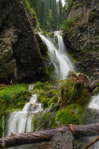 waterfall in the forest mountains