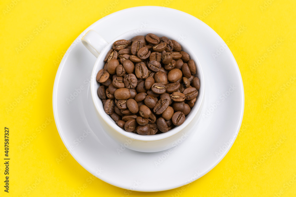 coffee cup with beans on yellow background coffee cup with beans on yellow background