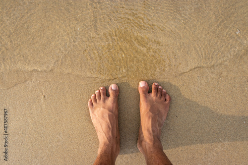 human feet feeling nature isolated on sandy beach