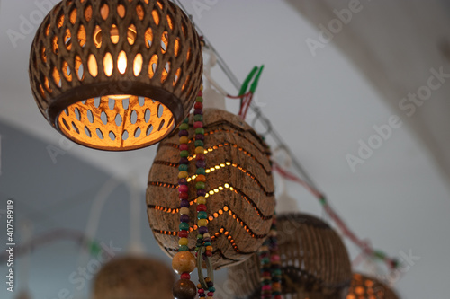 flower pots unique handicraft item made of coconut shells at street shop photo