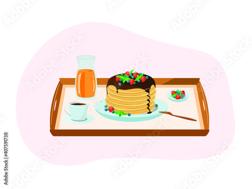 Breakfast on a tray. Pancakes with berries, a cup of coffee, orange juice, a plate of berries, strawberries, blueberries, mint