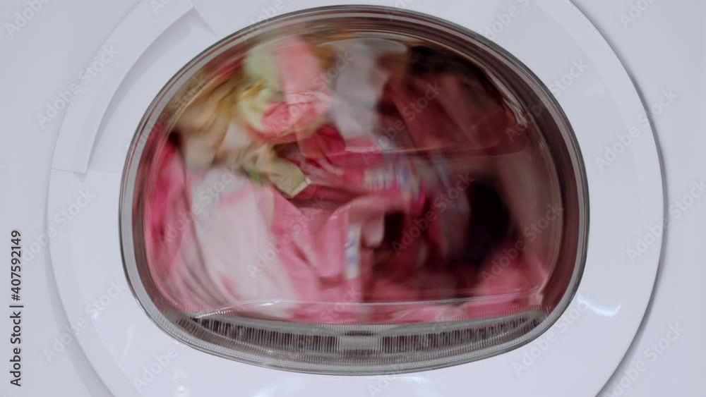 Things are spinning in the drum of a modern tumble dryer. Things are spinning in the drum of a modern tumble dryer.