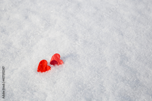 concept Valentines Day: red heart in the snow. salective focus photo