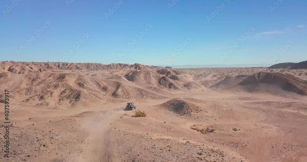 Off-road Vehicle driving in the desert Off-road Vehicle driving in the desert