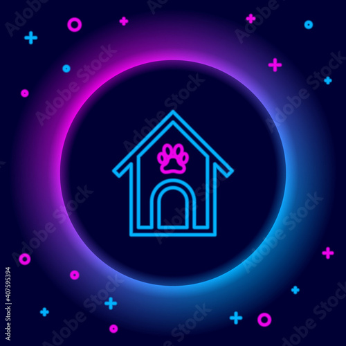 Glowing neon line Dog house and paw print pet icon isolated on black background. Dog kennel. Colorful outline concept. Vector.