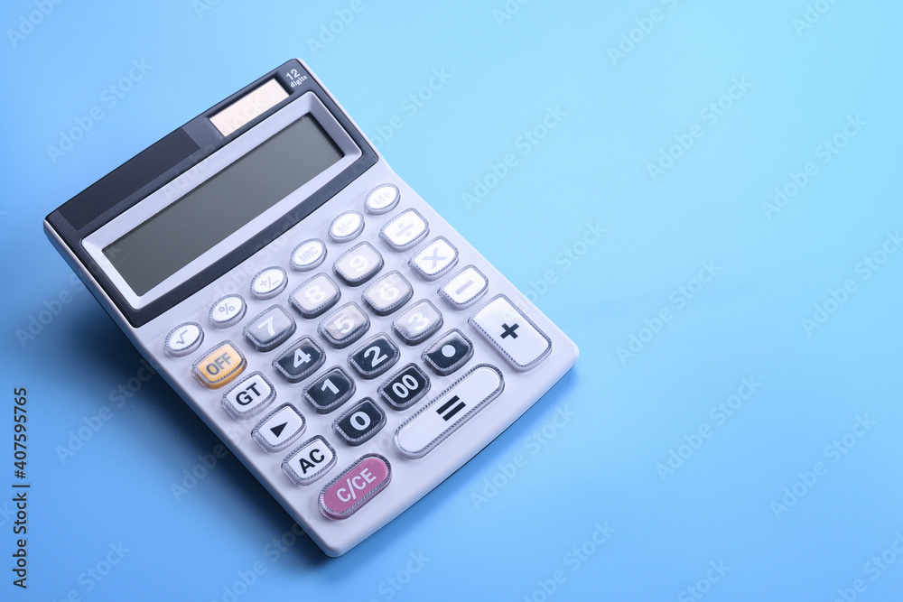 Calculator keypad on a blue background. Top view. Copy space Calculator keypad on a blue background. Top view. Copy space