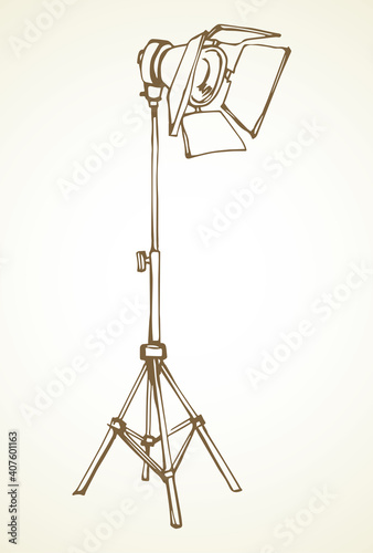 Spotlight on a stand. Vector drawing