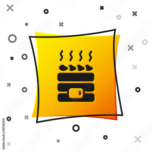 Black Hot sauna stones icon isolated on white background. Spa resort recreation, bathhouse relaxation. Hot stones on electric heater. Yellow square button. Vector.