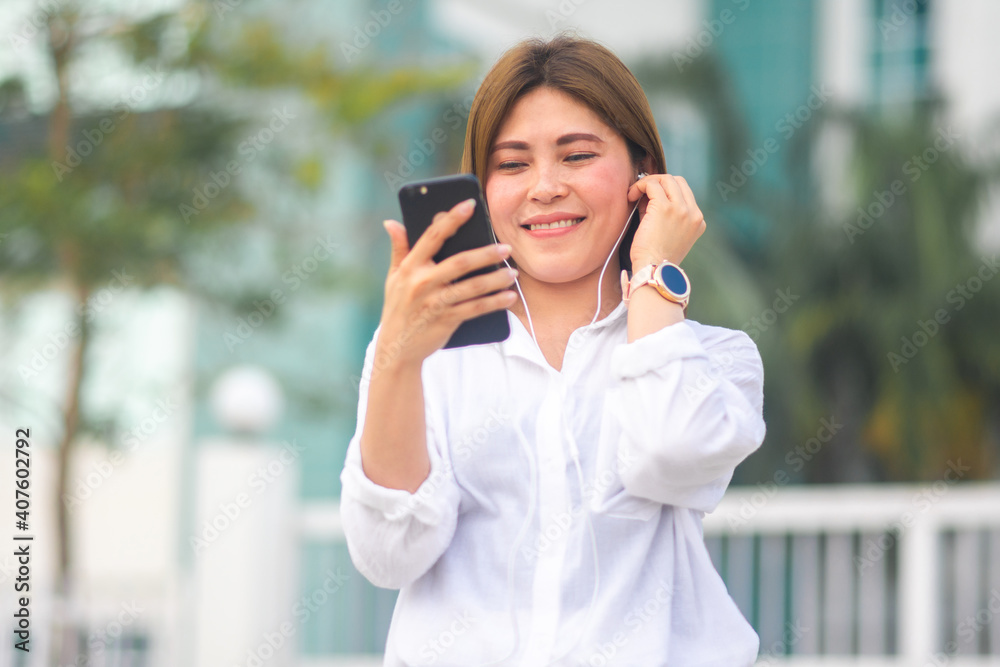 Asian women use mobile smartphone to shopping online at home outdoor Asian women use mobile smartphone to shopping online at home outdoor