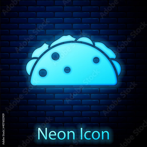 Glowing neon Taco with tortilla icon isolated on brick wall background. Traditional mexican fast food menu. Vector.