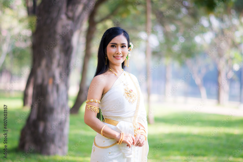 Asian Young women, Portrait of a beautiful thai woman wearing a thai dress,Smile with happiness. Asian Young women, Portrait of a beautiful thai woman wearing a thai dress,Smile with happiness.