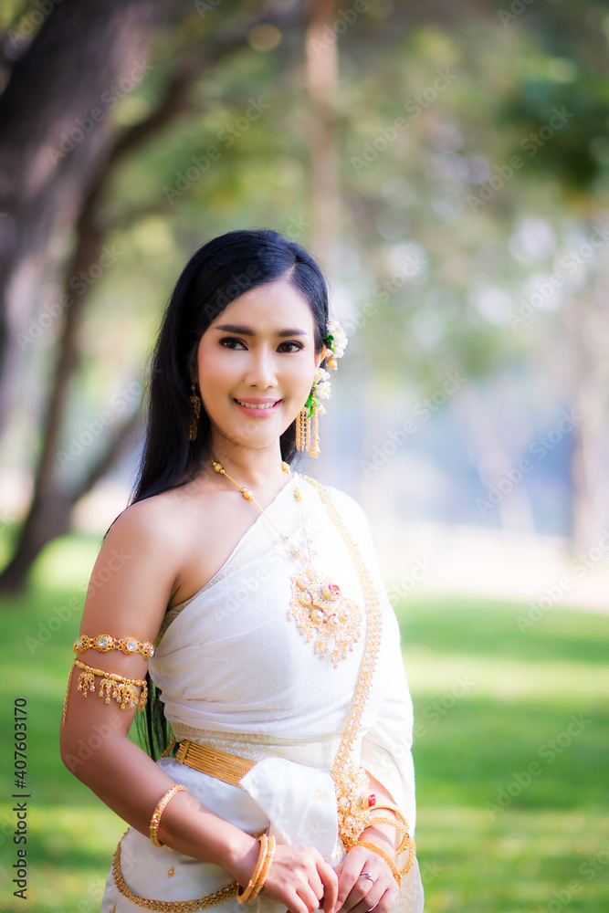 Asian Young women, Portrait of a beautiful thai woman wearing a thai dress,Smile with happiness. Asian Young women, Portrait of a beautiful thai woman wearing a thai dress,Smile with happiness.