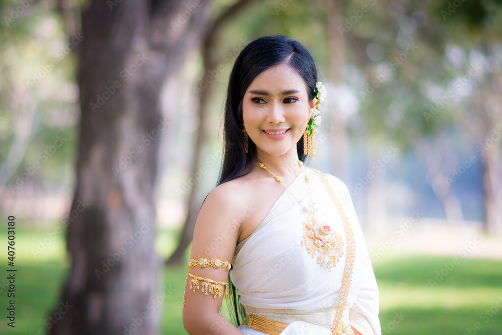 Asian Young women, Portrait of a beautiful thai woman wearing a thai dress,Smile with happiness. Asian Young women, Portrait of a beautiful thai woman wearing a thai dress,Smile with happiness.