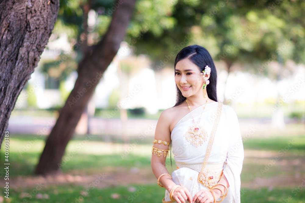 Asian Young women, Portrait of a beautiful thai woman wearing a thai dress,Smile with happiness. Asian Young women, Portrait of a beautiful thai woman wearing a thai dress,Smile with happiness.