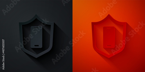 Paper cut Smartphone, mobile phone with security shield icon isolated on black and red background. Security, safety, protection concept. Paper art style. Vector.