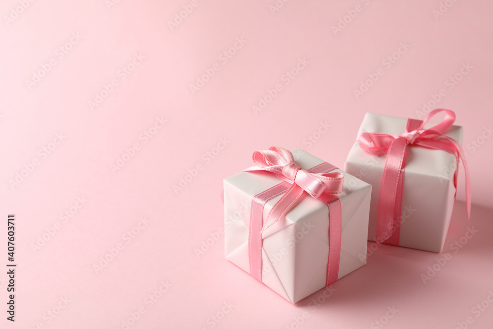 Fototapeta premium Gift boxes on pink background, space for text