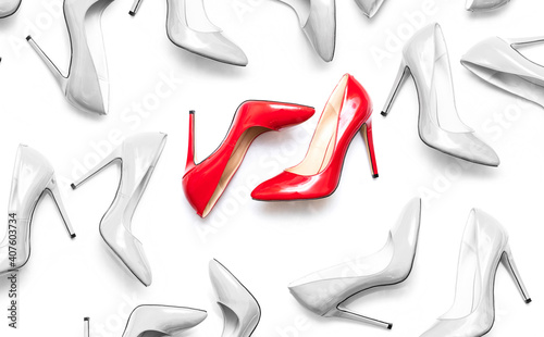 female shiny red and white stilettos on a white background photo