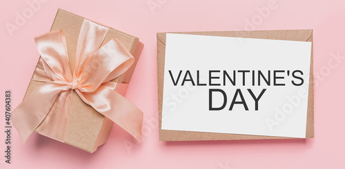 Gifts with note letter on isolated pink background, love and valentine concept with text Valentines Day