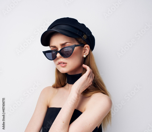 elegant woman black cap glasses modern studio luxury isolated background
