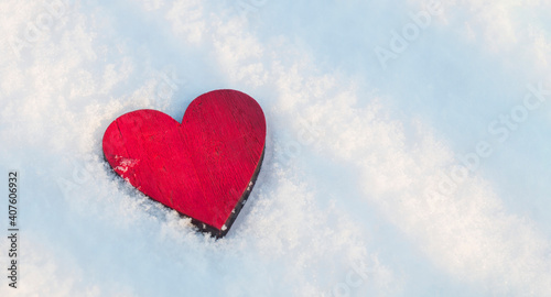 Red hot heart, on a snow cover, warming love
