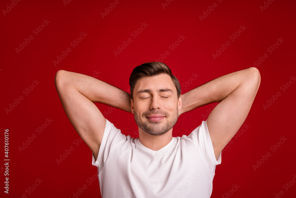 Photo portrait of millennial wearing white t-shirt sleeping after work dreaming closed eyes isolated vibrant red color background Photo portrait of millennial wearing white t-shirt sleeping after work dreaming closed eyes isolated vibrant red color background