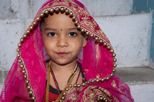 girl kid cute facial expression in marriage ceremony dress from unique low angle shot
