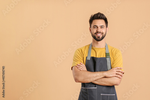 Young man wearing apron on ...