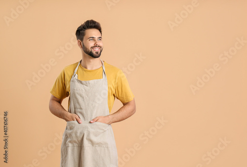 Young man wearing apron on ...
