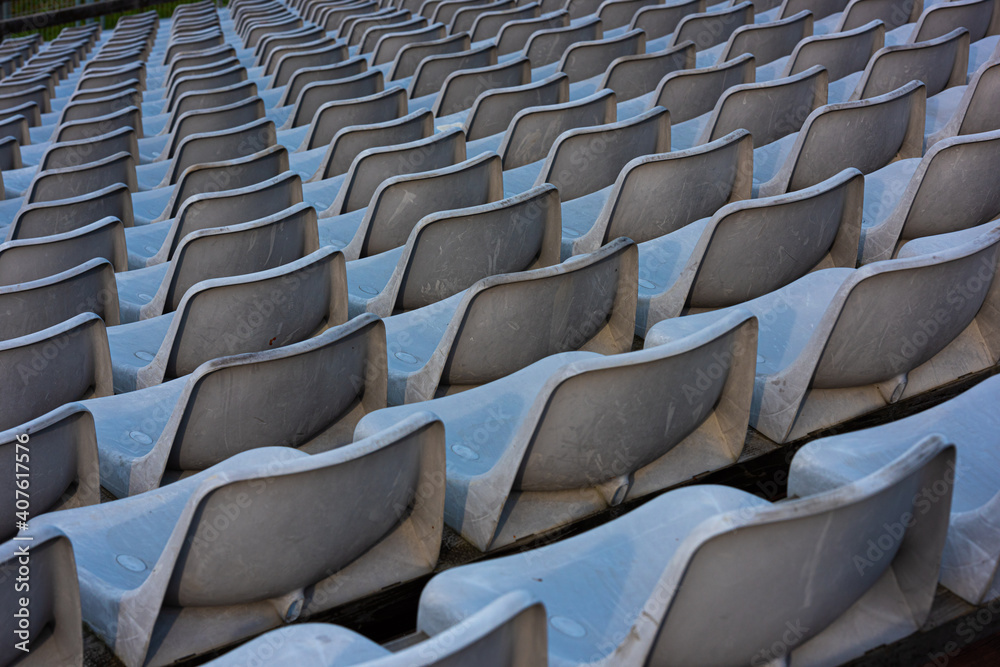 Fototapeta premium Empty grey seats on a seating tribune.