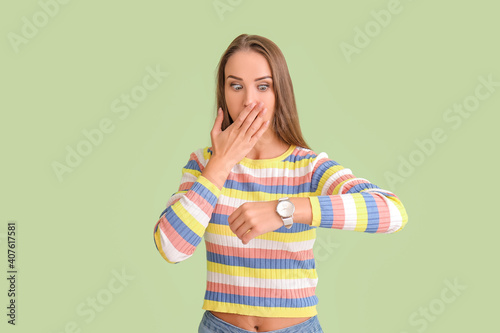 Shocked woman with wristwat...