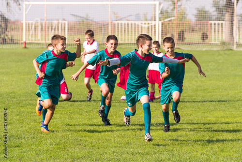 Kids soccer players celebrating in hug after victory © Dusan Kostic