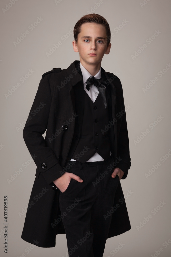 teen boy in stylish black coat