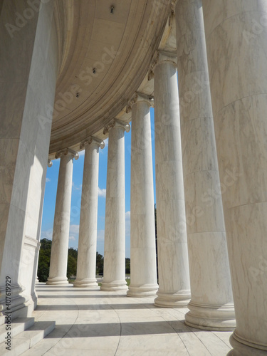 Sun shining through columns at the Jefferson Memorial in Washington DC