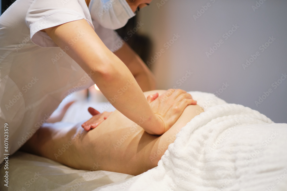 masseur makes anticellulite massage young woman in the spa salon. Body care concept. Special anticellulite treatment.