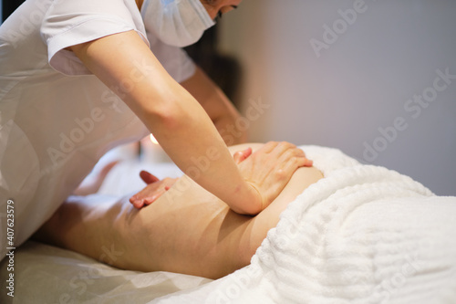 masseur makes anticellulite massage young woman in the spa salon. Body care concept. Special anticellulite treatment.