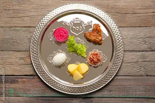 Passover Seder plate with traditional food on table photo