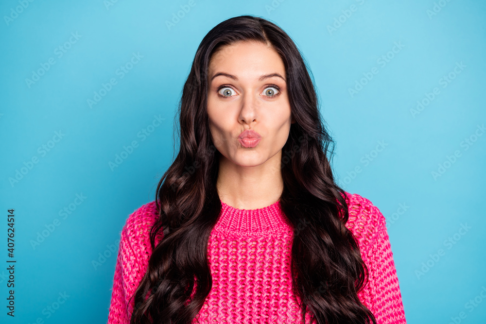 Portrait of attractive amorous wavy-haired girl sending air kiss 14 February isolated over vibrant blue color background Portrait of attractive amorous wavy-haired girl sending air kiss 14 February isolated over vibrant blue color background