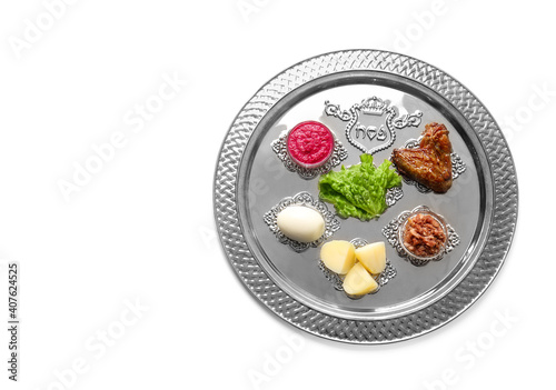 Passover Seder plate with traditional food on white background photo