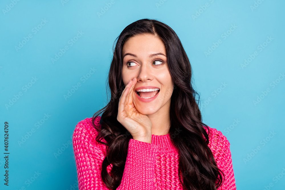 Portrait of attractive cheerful wavy-haired girl saying spreading good news ad isolated over vivid blue color background Portrait of attractive cheerful wavy-haired girl saying spreading good news ad isolated over vivid blue color background