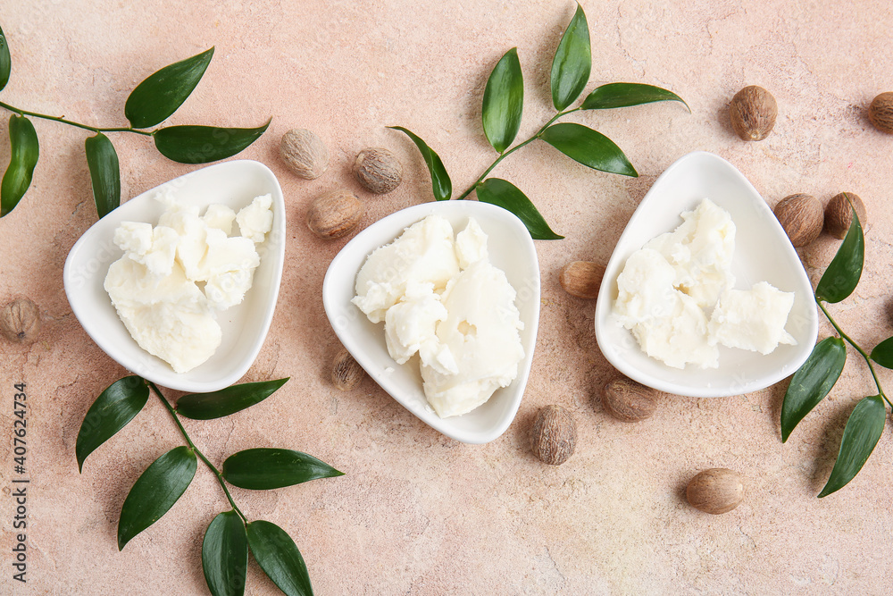 Bowls with shea butter on color background Bowls with shea butter on color background