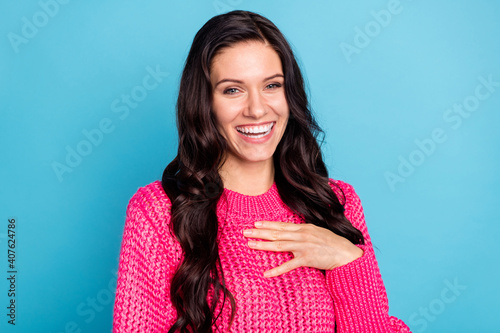 Portrait of attractive cheerful wavy-haired girl laughing having fun isolated over shine blue color background