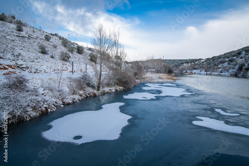 snow-covered and frozen river in "soria"