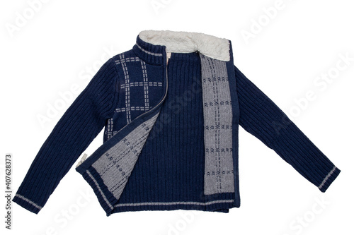 Autumn and winter clothes children. A cozy warm dark blue cardigan or jacket with a white checkered pattern for the little boy isolated on a white background. Kids spring fashion.