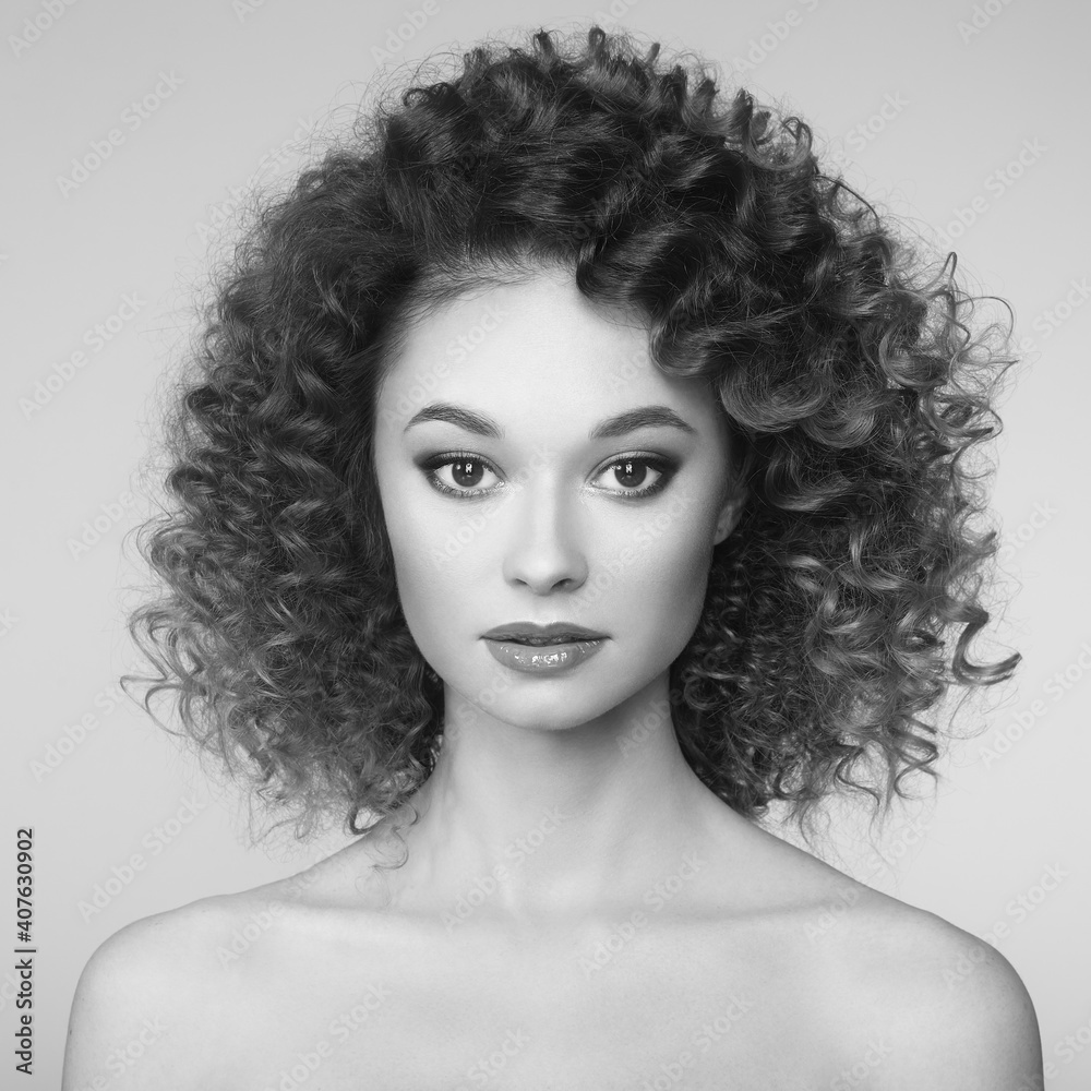 Fototapeta premium Beautiful woman face. Perfect makeup. Beauty fashion. Cosmetic. Eyeshadow. Elegant afro curly hairstyle. Black and white photo.