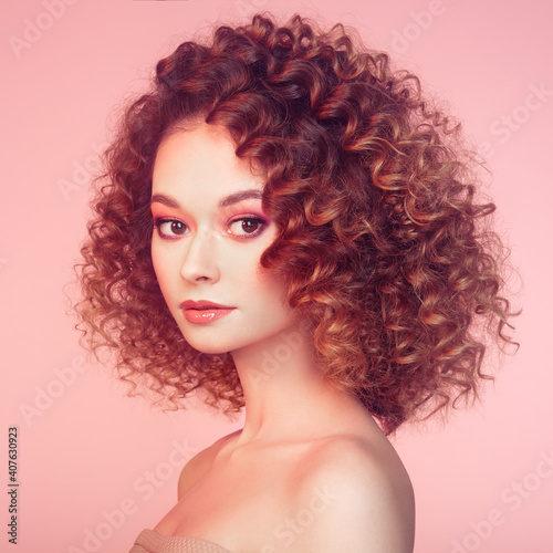 Beautiful woman face. Perfect makeup. Beauty fashion. Cosmetic. Eyeshadow. Elegant afro curly hairstyle.
