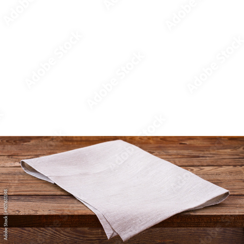 Empty wooden deck table with tablecloth over wall background