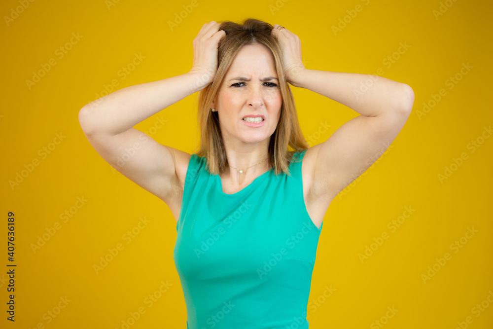 Young caucasian woman over isolated background doing nervous gesture Young caucasian woman over isolated background doing nervous gesture