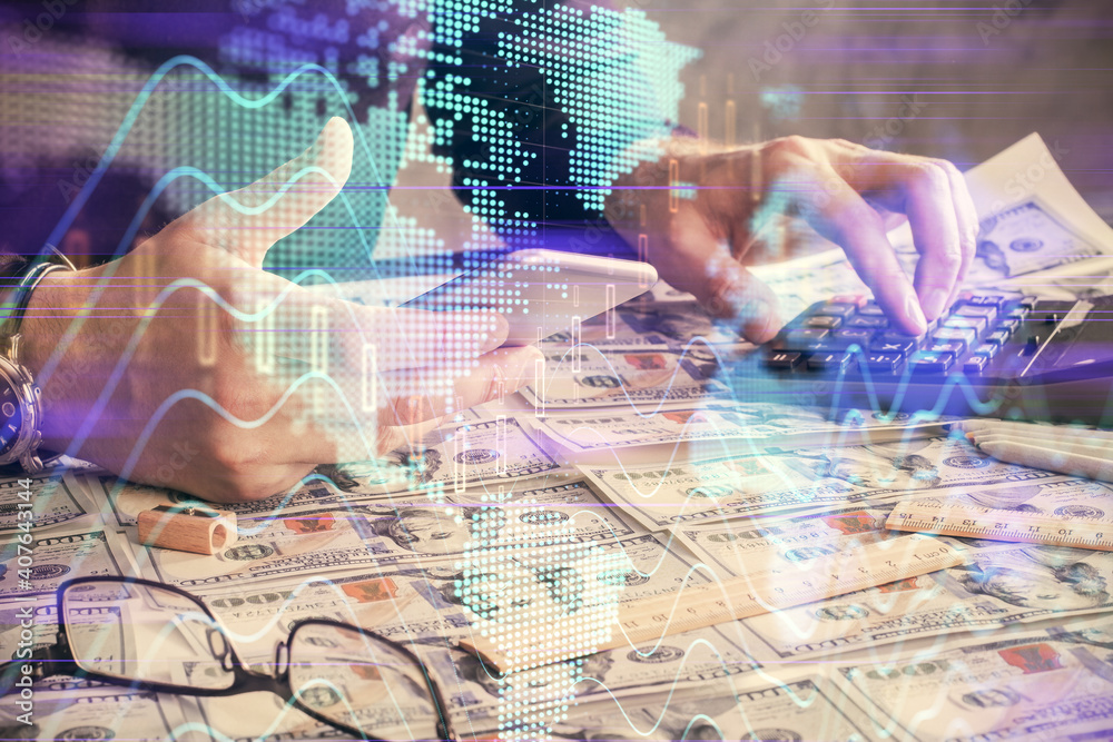 Double exposure of man's hands holding and using a digital device and forex graph drawing. Financial market concept. Double exposure of man's hands holding and using a digital device and forex graph drawing. Financial market concept.