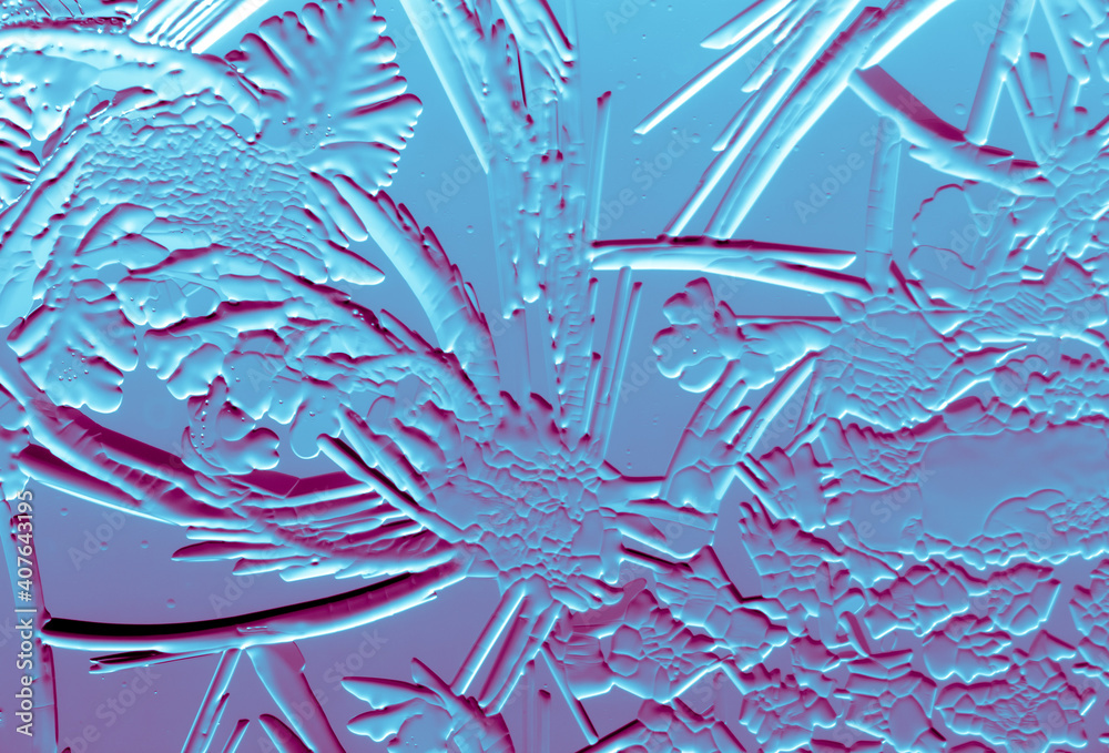 Blue-pink patterns from frost on glass as a background. Blue-pink patterns from frost on glass as a background.